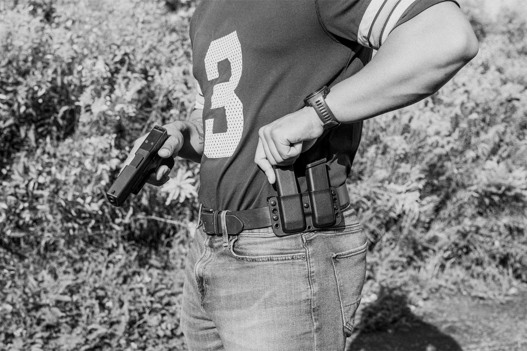 Person wearing Total Eclipse Double Mag Pouch Outside the Waistband (OWB) with EDC Gun Belt