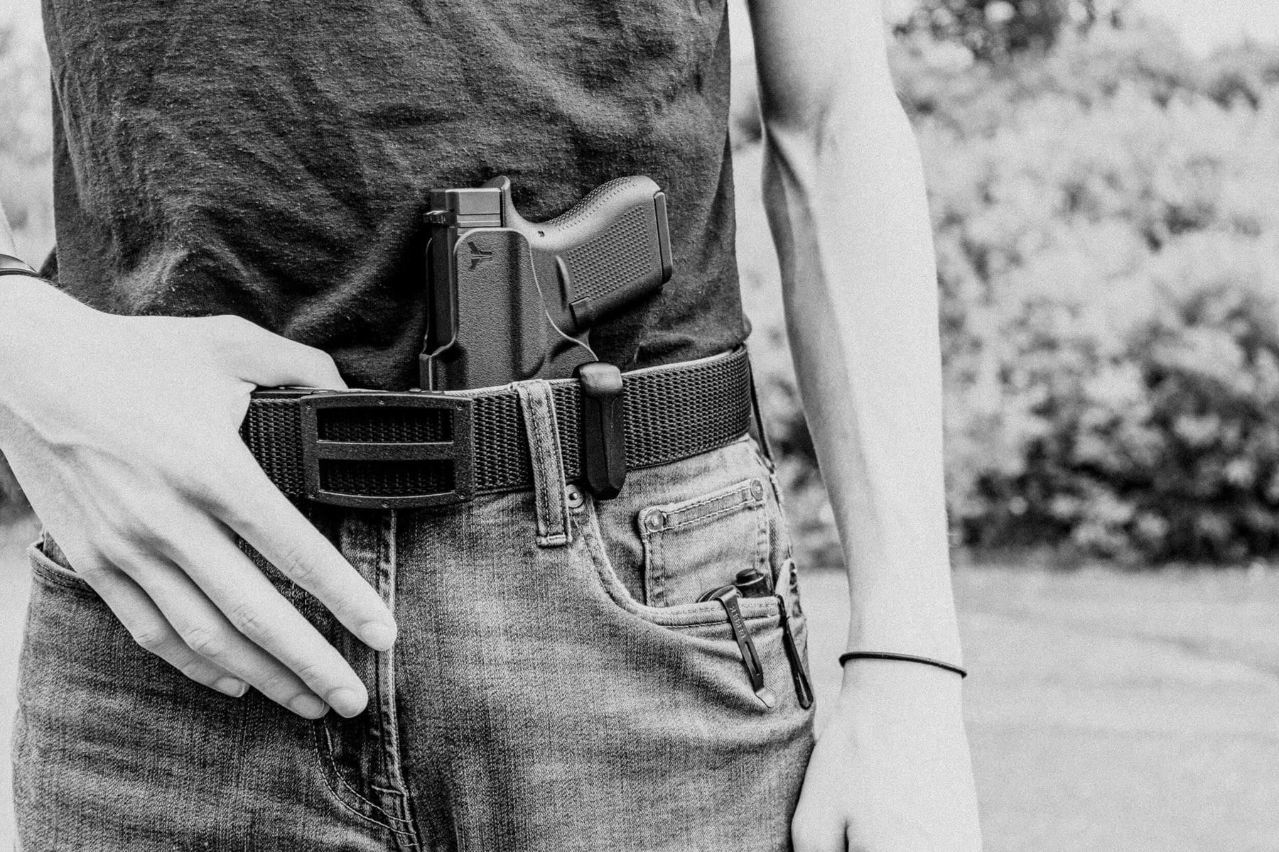 Person wearing Ultimate Carry Gun Belt with Ratcheting Belt Buckle and Ultimate Klipt Appendix Inside the Waistband (AIWB) Holster