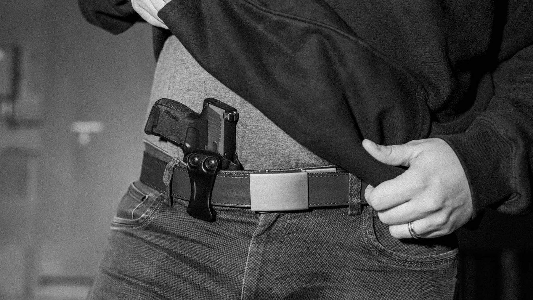 Person wearing Inside the Waistband (IWB) Nano Gun Holster with Ultimate Carry Gun Belt for Everyday Carry 