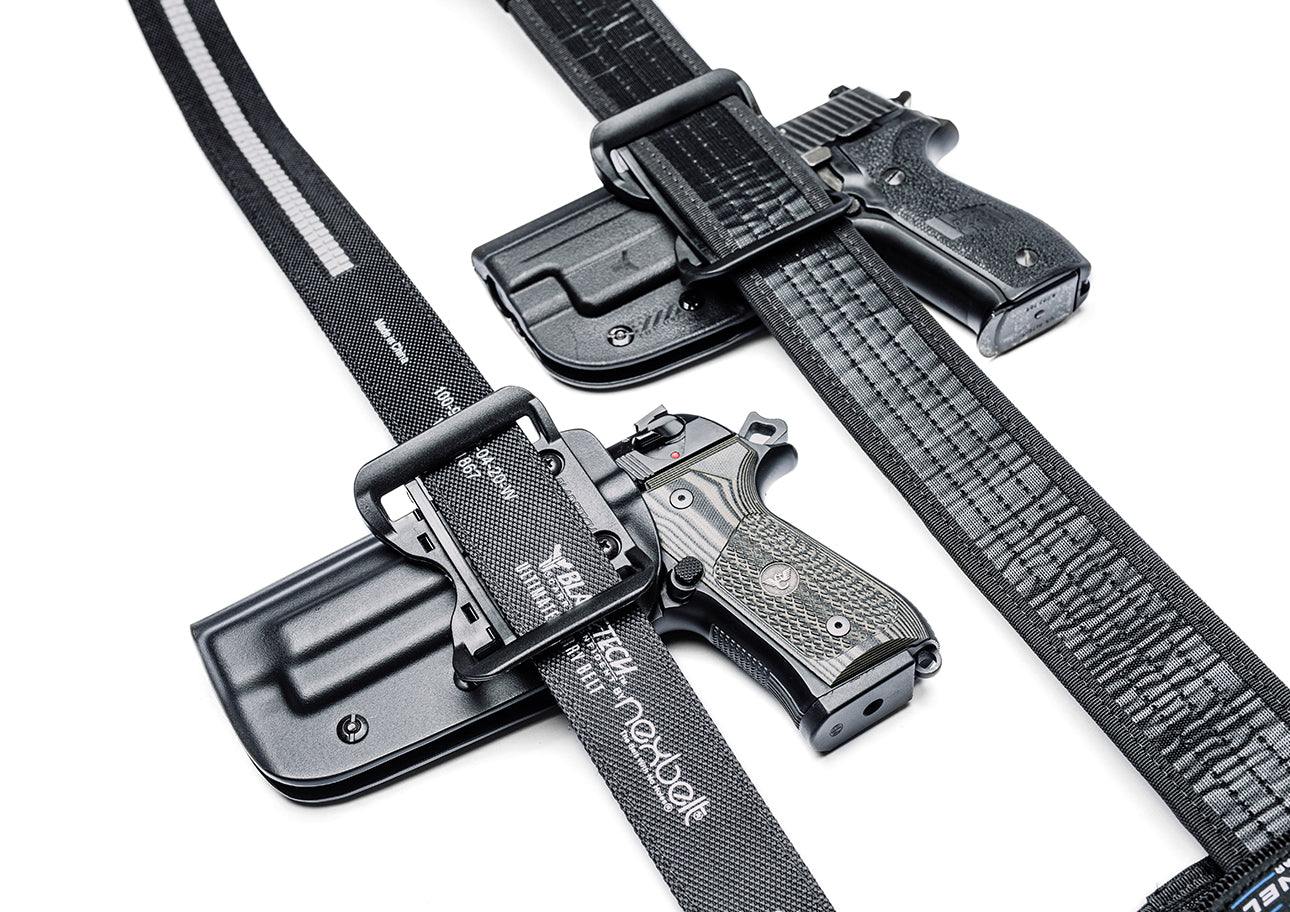 Signature Outside the Waistband (OWB) Holster with Adjustable Stingray Loop (ASR) mounted onto Duty Gun Belt and Classic Outside the Waistband (OWB) Holster mounted onto Ultimate Carry Gun Belt with Ratcheting Belt Buckle