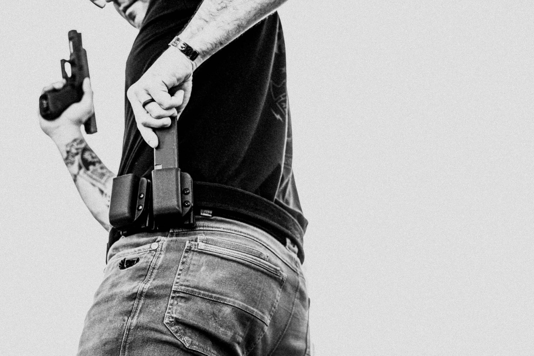 Person wearing Signature Single Mag Pouch Outside the Waistband (OWB) with Velocity Competition Belt 