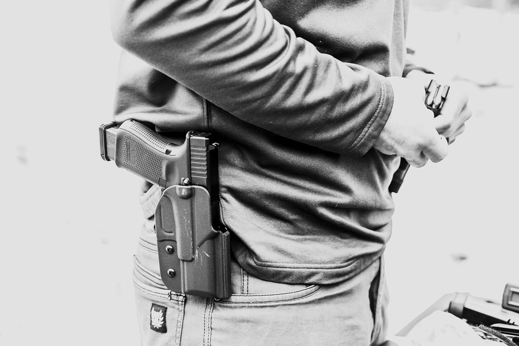 Person wearing Outside the Waistband (OWB) Signature Holster