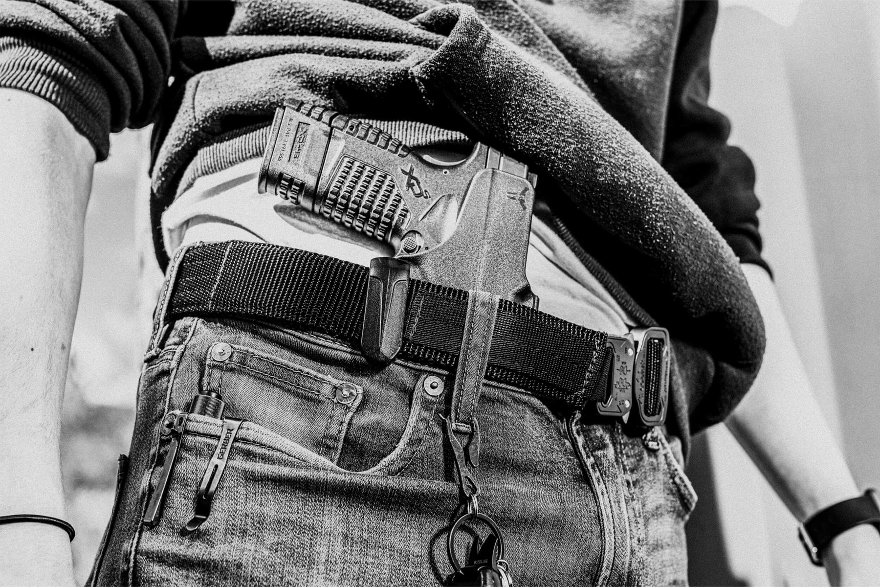 Person wearing Appendix Inside the Waistband (AIWB) Ultimate Klipt Holster and Instructor's Belt with AustriAlpin COBRA® Buckle 